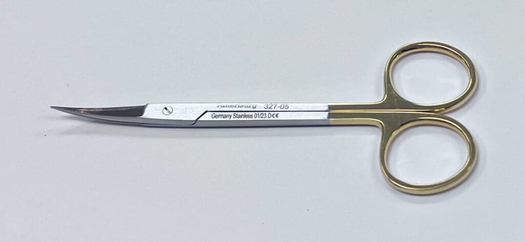 A pair of TC IRIS SCISSORS with a gold handle.