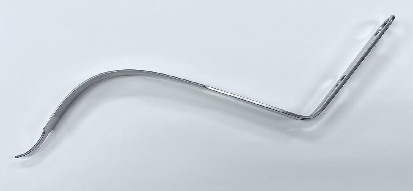 An APC TYPE HIP RETRACTOR, SINGLE PRONG curved handle on a white surface.