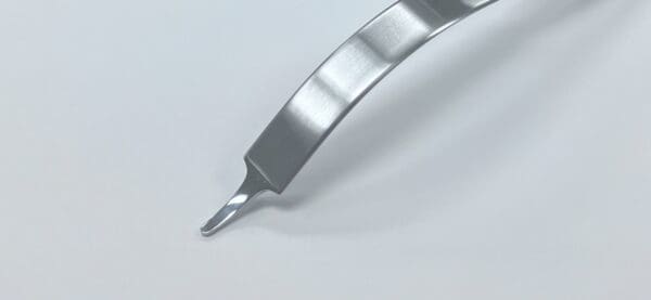 A SOFT TISSUE RETRACTOR, SINGLE PRONG on a white surface.