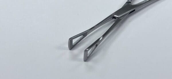 A close up of a tweezers.