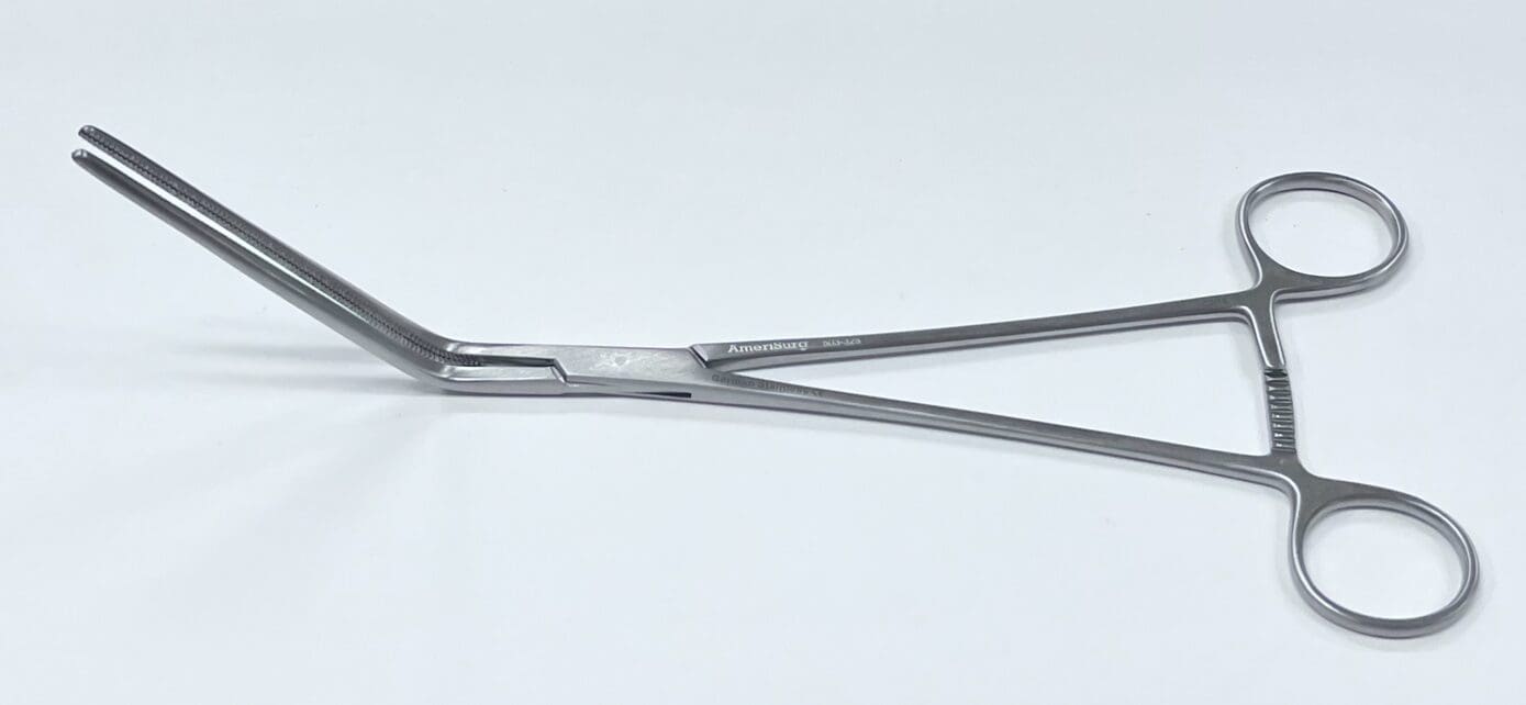 A pair of Glassman stomach resection clamps on a white surface.