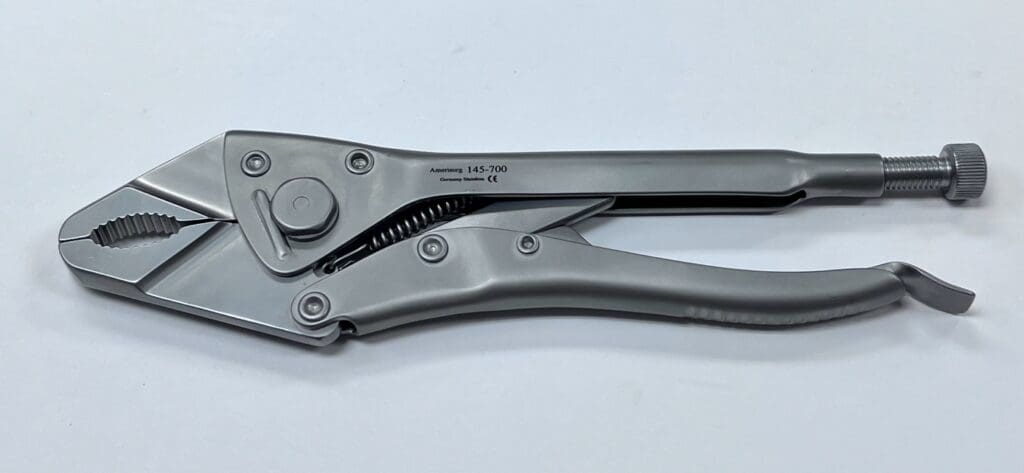 A pair of LOCKING PLIERS, SNUB NOSE on a white surface.