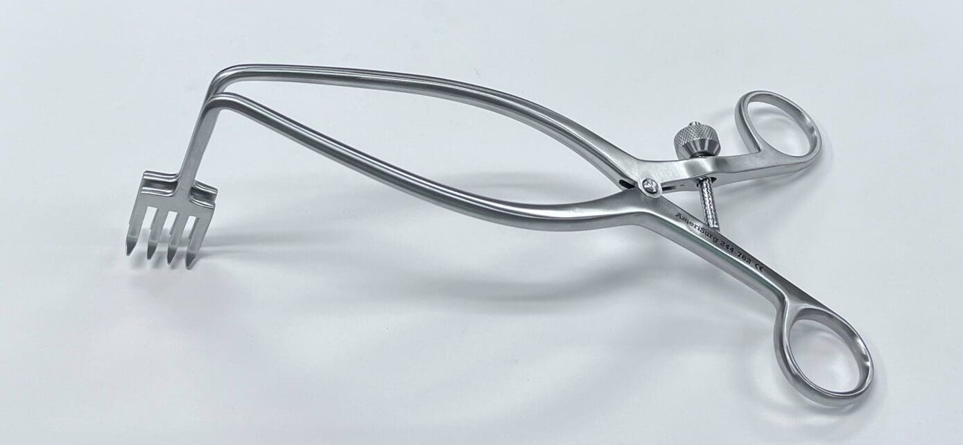 A pair of ZELPI STYLE WEITLANER RETRACTOR on a white surface.