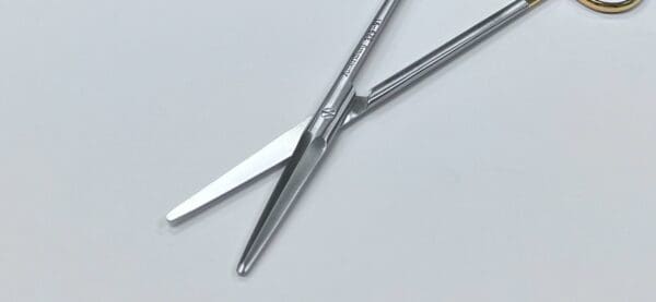 A pair of TC GORNEY FACE LIFT SCISSORS on a white surface.
