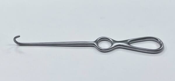 A VOLKMAN BONE HOOK with a handle on a white surface.