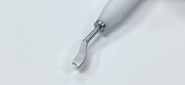 A MORELAND TYPE FEMORAL/TIBIAL EXTRACTOR, OFFSET with a metal handle on a white surface.