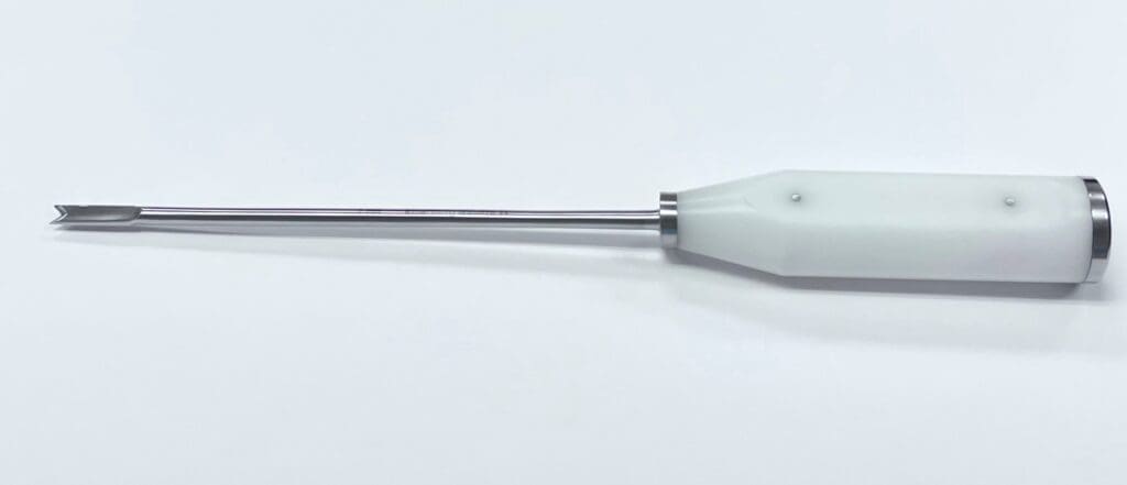 A MORELAND TYPE "V" OSTEOTOME, 13" white plastic tool with a metal handle on a white surface.