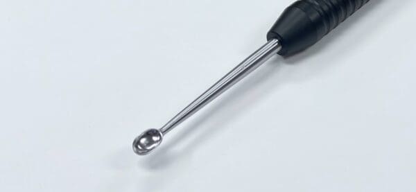 A close up of the KARLIN MAGNUM CUP CURETTE.