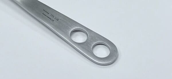 A Hohmann retractor, 18mm, standard with two holes on it.