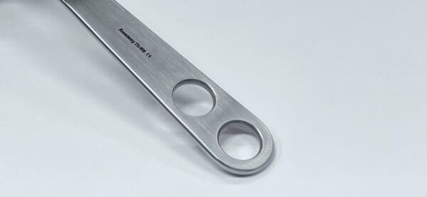 A Hohmann retractor, 70mm, standard with a hole in it.