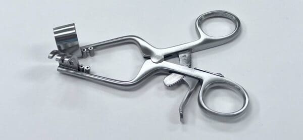 A Williams distal radius fracture retractor with holes.