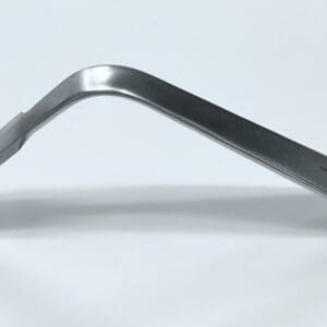 A Hohmann retractor, bent, narrow on a white surface.