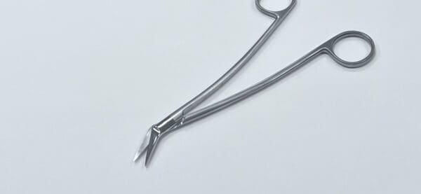 A pair of CONVERSE DORSAL SCISSORS on a white surface.