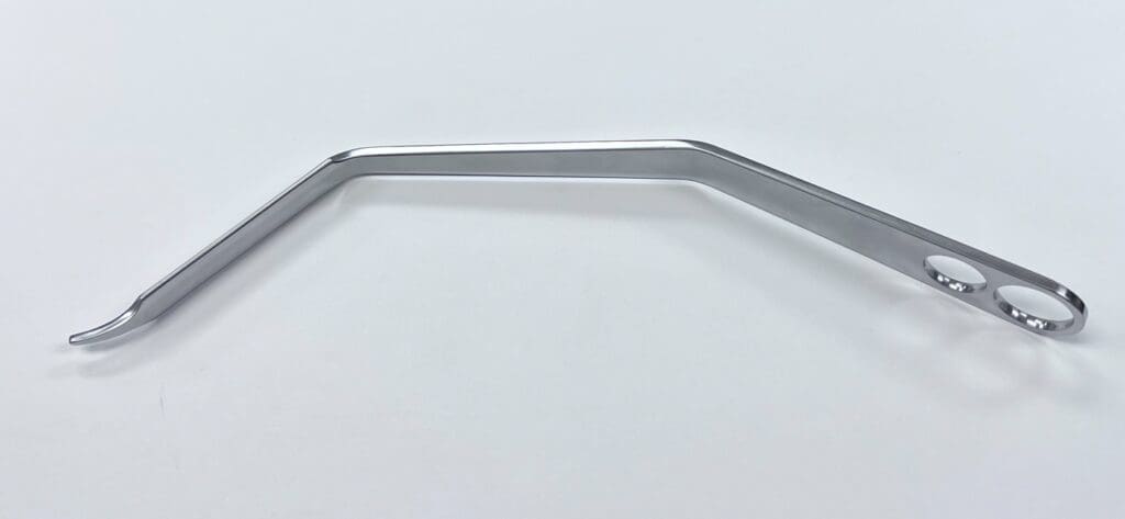A HOHMANN RETRACTOR, SINGLE PRONG DOUBLE BENT on a white surface.