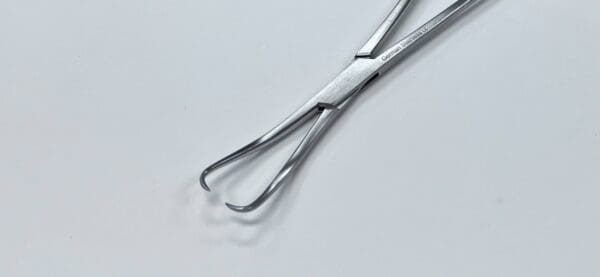 A pair of JARCHO VULSELLUM FORCEP on a white surface.