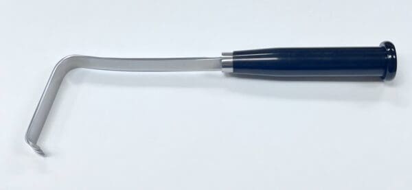 A blue plastic HAWKINS TYPE ANTERIOR CAPSULE RETRACTOR with a handle on a white surface.