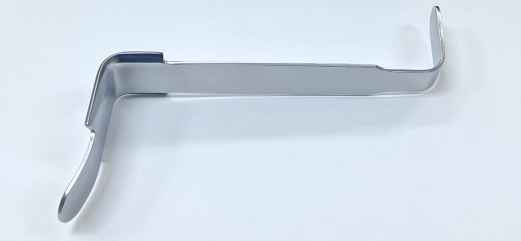 A Hawkins Type Deltoid Retractor on a white surface.