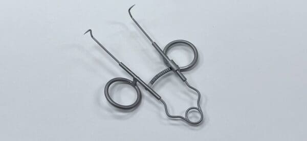 A pair of SPRING RETRACTOR.