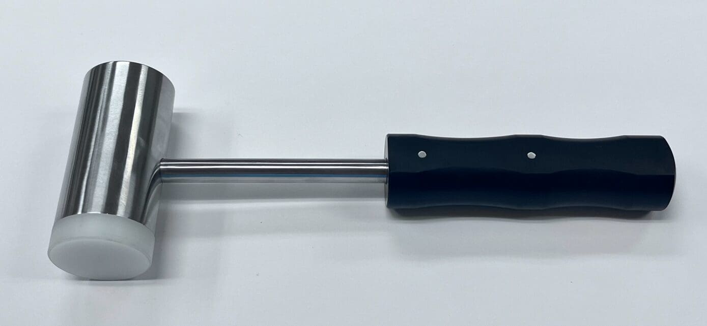 A black and silver MALLET.