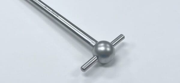 A silver MEYERDING HIP & SHOULDER SKID with a round ball on a white surface.